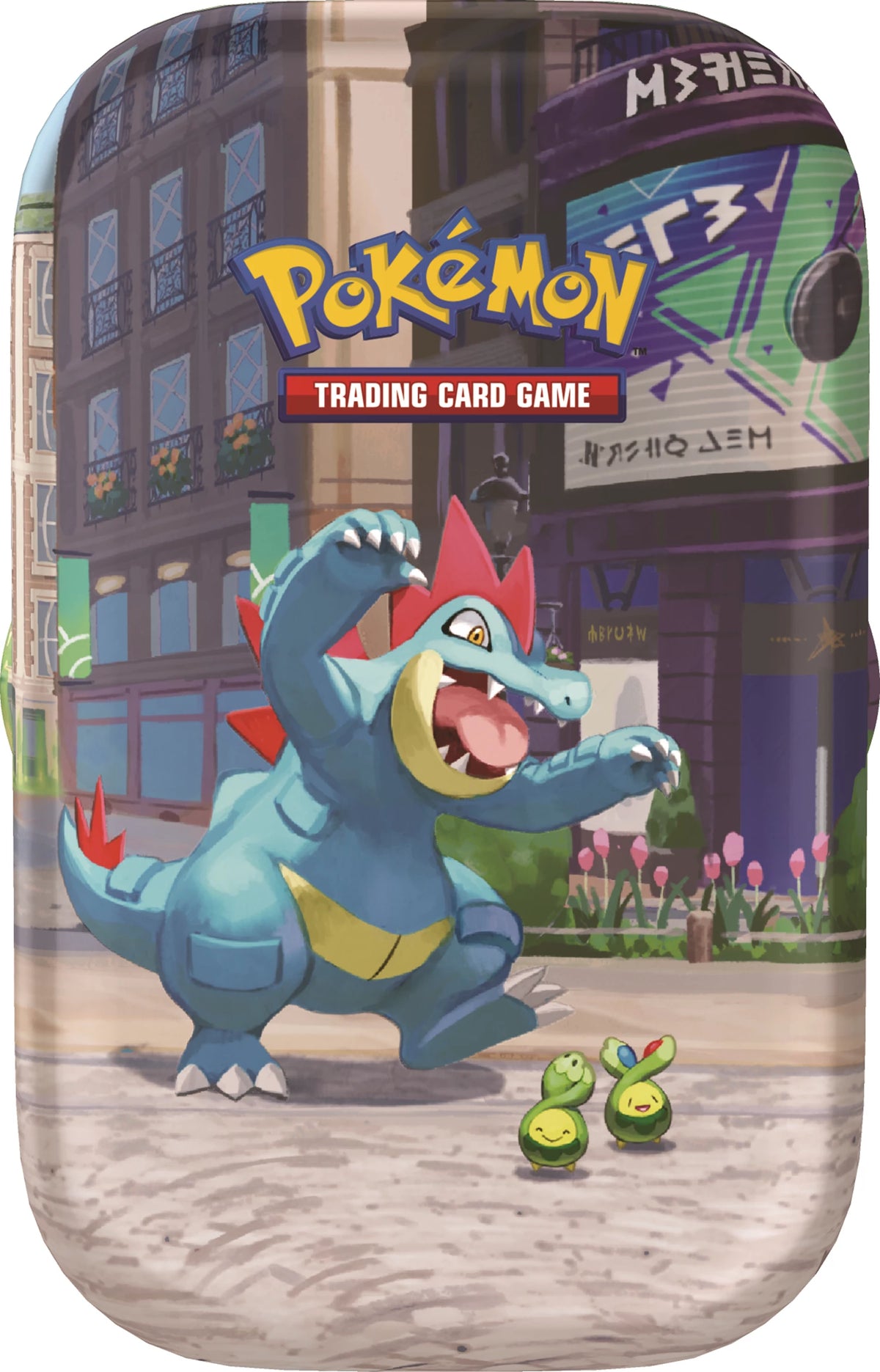 Pokémon Mini-Tin mit blauem Drachen-Pokémon und zwei kleinen grünen Pokémon vorne